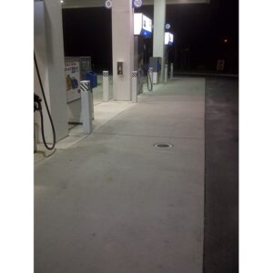 Gas station concrete that was recently cleaned with EBC Enviro Bio Cleaner, a general purpose pressure washing chemical