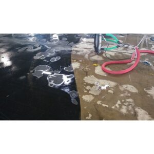 Partially cleaned concrete, demonstrating the side-by-side power of EBC Enviro Bio Cleaner, a general purpose pressure washing chemical
