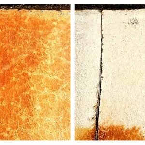 Extreme close up of a rusted sidewalk cleaned with Rust Remover Plus™, a pressure washing chemical
