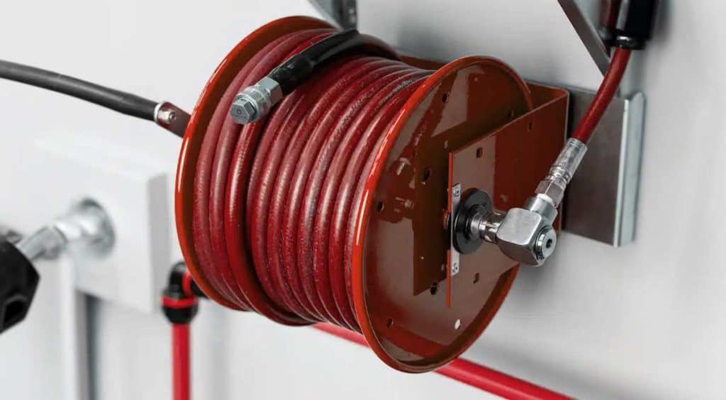 Garden hose reels with secured nozzles?