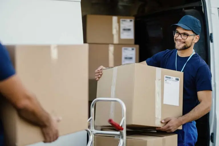 Man unpacking shipping boxes